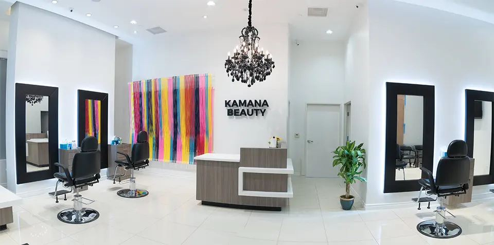 Kamana Beauty reception and threading chairs, with salon signage
